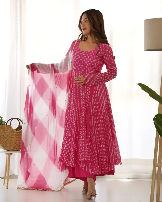 flamingo anarkali set . This set is having round neck with back neck tasseled paired with falred palazzo along with lejeriya chiffon dupatta detailing of lace.The colors seen in the image may vary from the actual product due to different computer scree